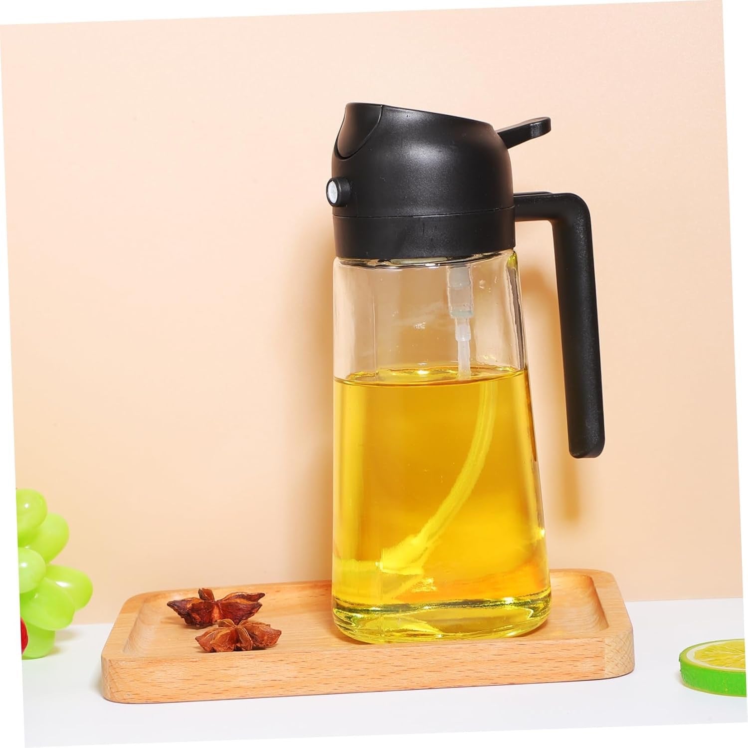 2-in-1 oil sprayer bottle on a kitchen tray